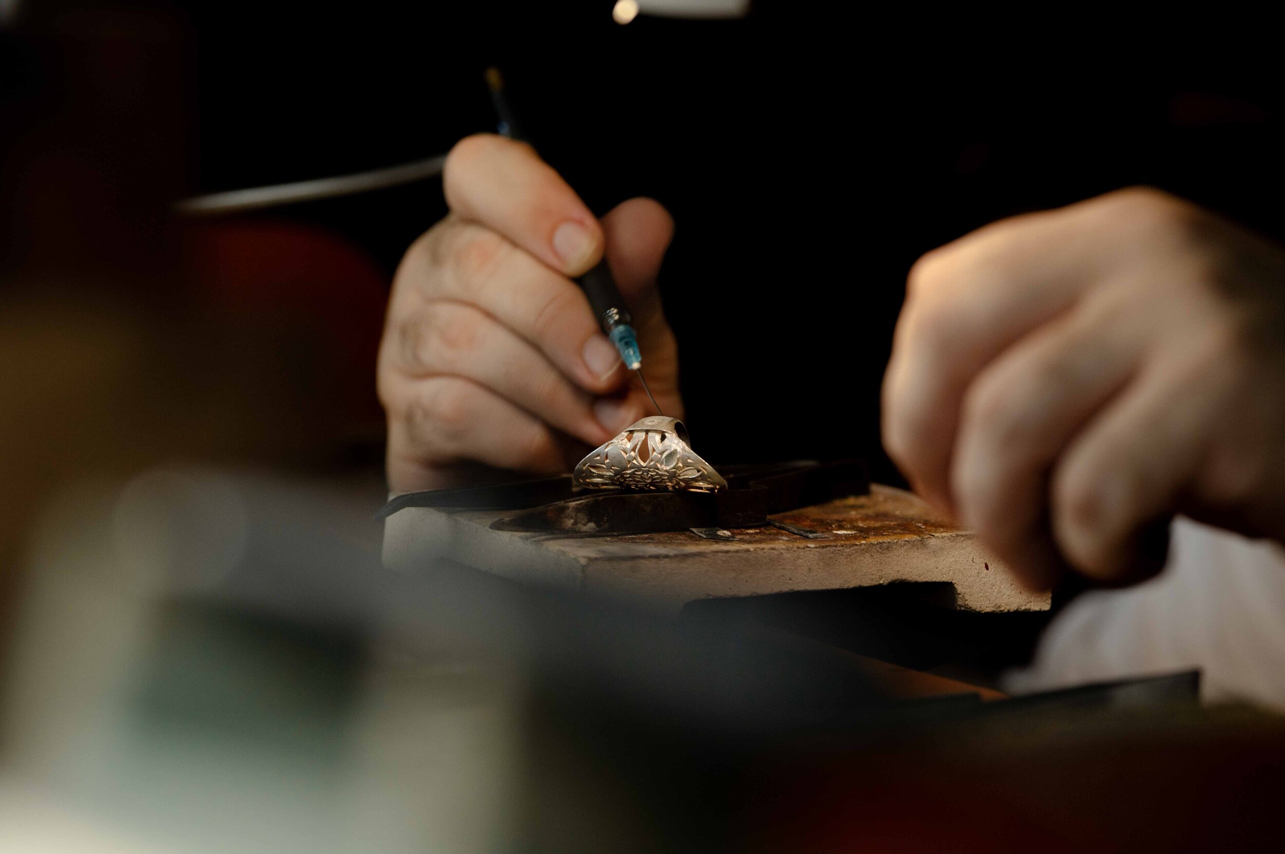 Jeweler working carefully at a bench